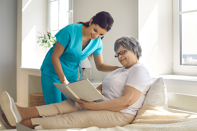 Caregiver in a nursing home discusses a book