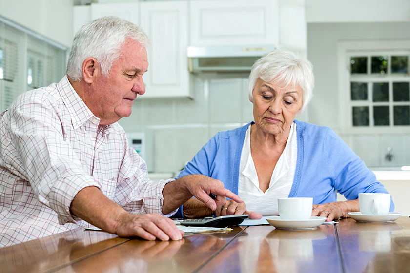 Senior couple with documents